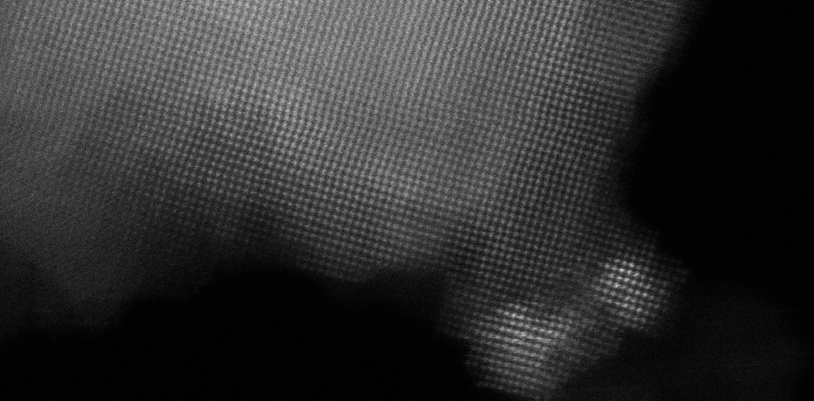 Atomic-resolution STEM image of Ni/MgO–Al₂O₃ — each bright dot is an individual atom